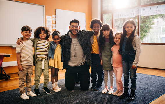 Class photo for this elementary school teacher and his students