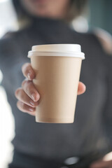 Man Holding a Coffee Cup in Hand