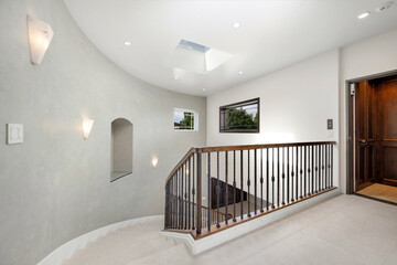 Inviting entrance to a beautiful home with a charming stairway in California
