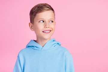 Photo of creative clever boy toothy smile look empty space brainstorming isolated on pink color background