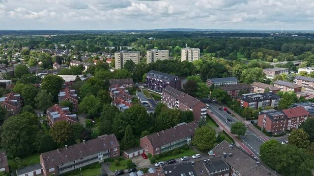 An aerial drone view of residential buildings along Aasee Lake in M&uuml;nster-Aaseestadt, Germany.