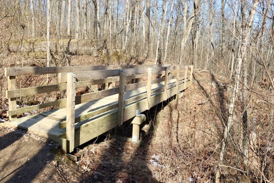 A close view of the wood bridge in the forest.