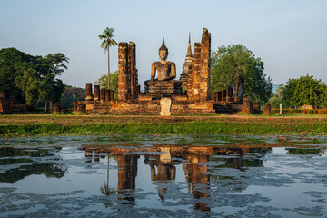 Wat Mahathat Temple in the precinct of Sukhothai Historical Park, Thailand. - obrazy, fototapety, plakaty