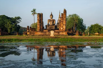 Fotobehang Wat Mahathat Temple in the precinct of Sukhothai Historical Park, Thailand. © yotrakbutda