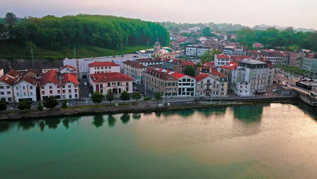 Aerial view of Bayonne city in Basque Country region by the river. Narrow medieval streets and red rooftop buildings. Basque culture and history. Southwest France, where the Nive and Adour rivers meet