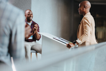Smiling african american professionals engaging in a cheerful conversation at a modern office reception area - 782137273