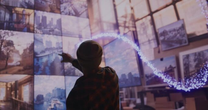 A Man Standing In Front Of A Wall Of Pictures In A Building Science Museum Video Art Augmented Reality