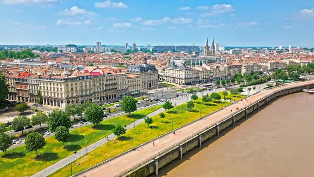 Aerial view of Iconic city square architecture in Bordeaux, France. French Historical landmark Place de la Bourse and Towering Romanesque cathedral Cath&eacute;drale Saint-Andr&eacute; de Bordeaux in France.
