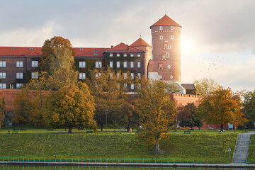 Krakow, Poland. 09.10.2022 Historical Wawel Castle and the Vistula River at dawn in autumn In the...