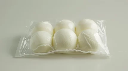 Fotobehang The simple elegance of Buffalo mozzarella cheese, visible through its clear packaging, serene © Paul