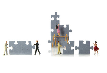 getting the solution for the puzzle by man and woman teamwork miniatures - 782161448