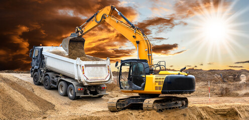  excavator is working and digging at construction site - 782179206