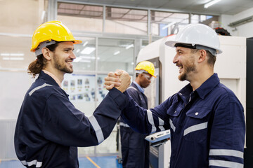 head technician engineer explain and advise a new technology of machine equipment to work in production line to factory worker. industrial worker talking and relax with friend after work.