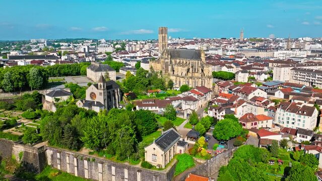 Aerial view of Roman Catholic church located in Limoges city, medieval timber-frame houses and buildings. Panoramic view of Gothic Cathédrale Saint-Étienne de Limoges and the city's medieval enamel.
