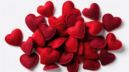 A pile of red felt hearts on a white surface. Suitable for Valentine's Day or love-themed designs