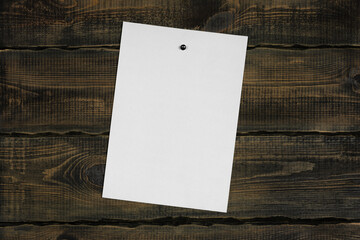 White blank notepaper and space for text with push pins on wooden background. note blank color...