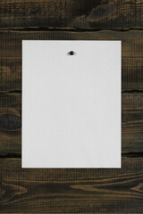 White blank notepaper and space for text with push pins on wooden background. note blank color...