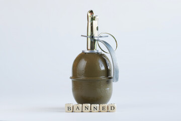 Inscription banned next to a hand grenade. White background. Concept of banned internet forum,...