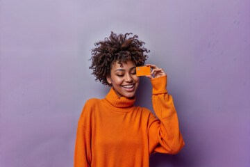 Happy woman paying with a card 