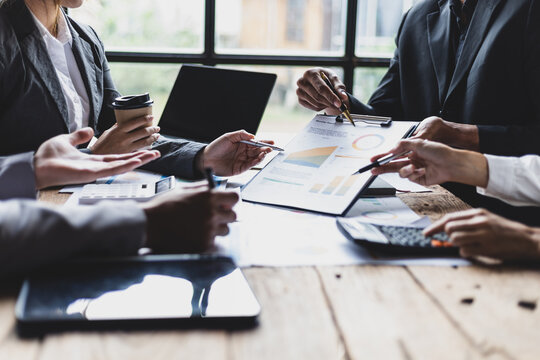 Business consulting meeting to discuss investment situation analysis and financial information for business strategy planning. Colleagues meeting to brainstorm statistical data analysis. - Powered by Adobe