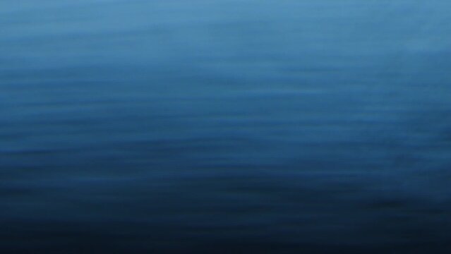 Deep blue gradient waves, powerful ocean vibes. Darkening blue gradient with strong horizontal waves evokes the power of the ocean.