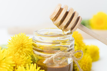 Obraz na płótnie Canvas Syrup, dandelion honey, composition with fresh flowers