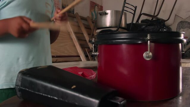Hands of A Young Boy Playing A Snare Drum and Cowbell at his Home in Argentina. Close Up. 4K Resolution.
