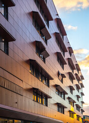 modern building facade reflect sunset color