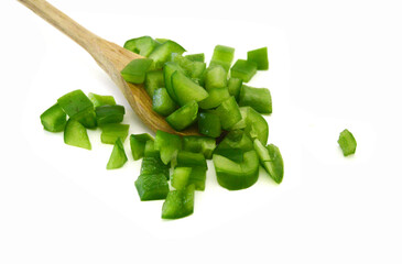 Sliced green bell pepper in a bowl on white background - 782220205