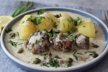 Classic Comfort: Homemade Königsberger Meatballs with Caper Sauce and Boiled Potatoes