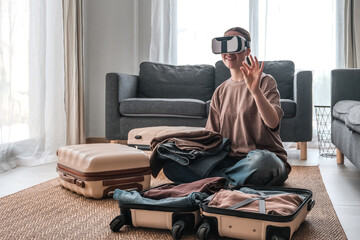 Travel,woman packing luggage in suitcase and travel in VR glasses nature,virtual reality exercise,...