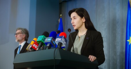 Female representative of the European Union during press conference. Confident politician makes an...