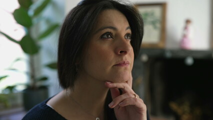Pensive Woman in Her 30s Contemplating, Close-Up of Face in Deep Thought, Indoor Home Setting....