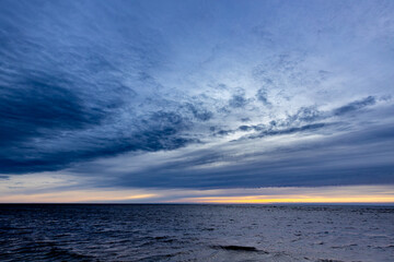 Sunset in cold spring on the seashore