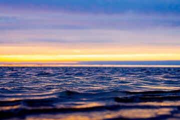 Fototapeta na wymiar Sunset in cold spring on the seashore