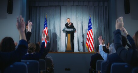 Confident American republican politician delivers successful speech to supporters at government...