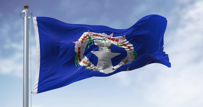 Flag of the Northern Mariana Islands waving in the wind on a clear day