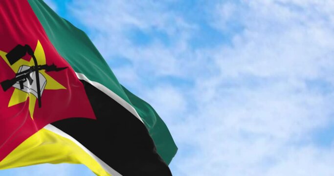 Close-up of Mozambique national flag waving on a clear day