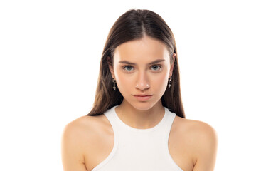 portrait of a young serious teenage girl on a white background