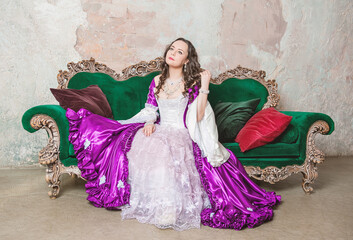 Smiling beautiful woman in fantasy white and purple rococo style