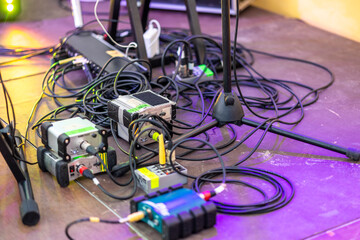 Confusion of cables and boxes and musical equipment