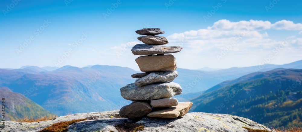 Sticker Rocks atop mountain with scenic backdrop