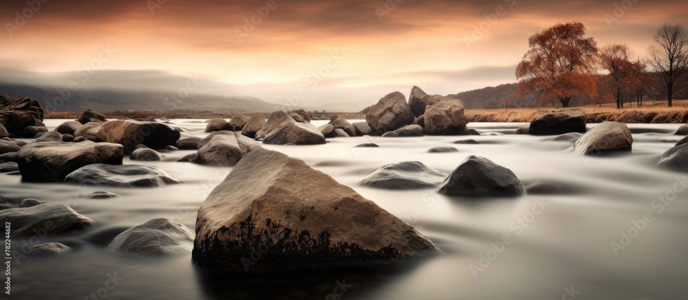 Poster river with rocks and trees in background