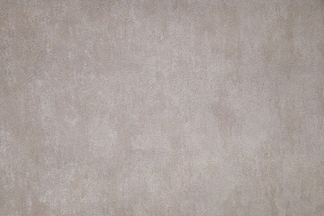 Gray beige textured wall surface. Rough stylized texture. Abstract decorative background. Old effect background for wallpaper or graphic design.