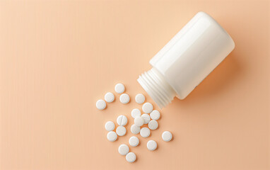 White pill bottle tipped over with pills scattered, beige color background, top view - pill bottle, healthcare medication spill, pharmaceuticals medical supplies.