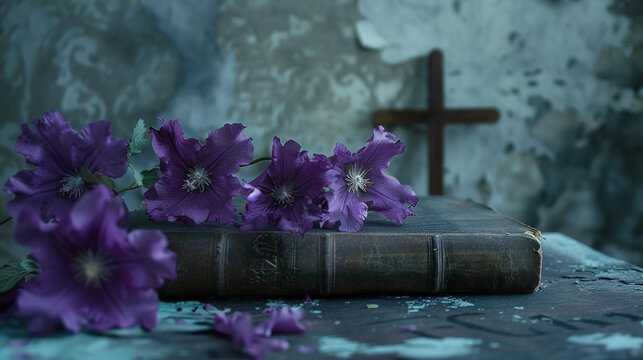 purple flowers on an old book with cross on background