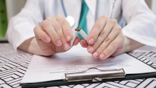 stop nicotine, doctor breaks a cigarette, refusal of smoking