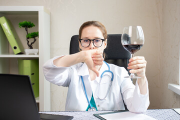 Doctor refuse alcohol, shows thumbs down to glass of wine, medical treatment, liver cancer...
