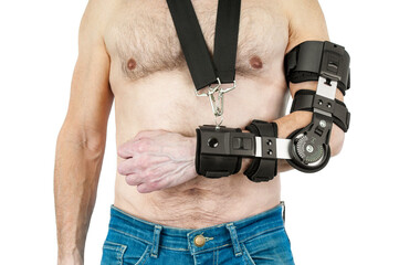 Man with a broken arm wearing in adjustable sling on white background