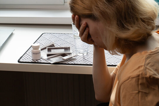 Abortion tablets, person with medication, emotional distress, healthcare decision